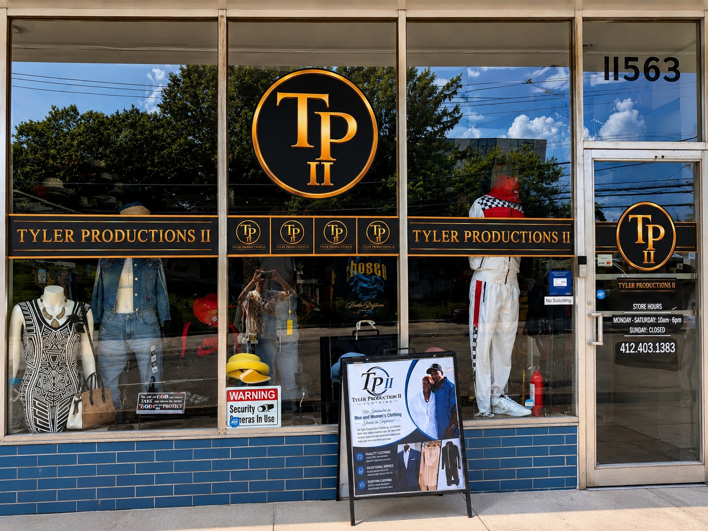 Tyler Productions II storefront with custom gold-and-black window graphics